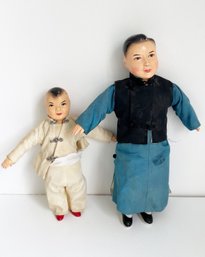 Two (2) Vintage Asian Composition Male Dolls With Cloth Bodies.