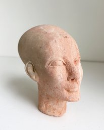 Decorative Head Bust Inspired By Ancient Egyptian Art. Clay/stone With Red Pigments.