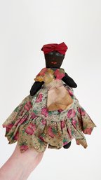 Vintage, Handmade Folk Art Black Cloth Doll. Floral Dress And Red Head Band. (9 Inches Tall)
