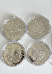 Four (4) Silver $20 Liberia Coins.