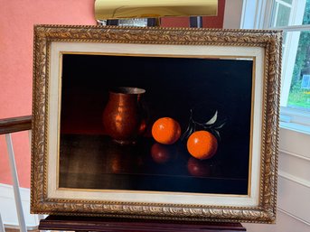 Realistic Still Life Painting Of Oranges Against A Dark Background In Gold Frame