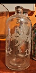 Etched Glass Apothecary Bottle With Floral Bow Design And Metal Stopper