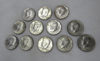 Lot 12 Kennedy Half Dollars, Three 1964 Solid Silver Content, Five 1967 Clad, Four 1968 Clad