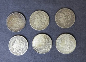 Six Morgan Silver Dollars