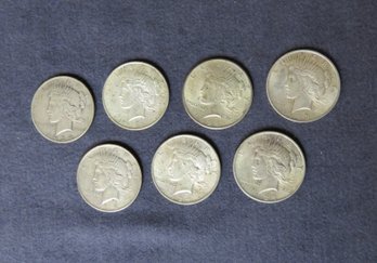Seven Peace Dollars 1934-D, 1922, 1924, 1923, 1922, 1924. 1924