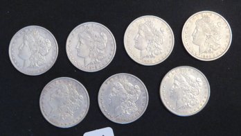 Seven Morgan Silver Dollars, 1878, 1878-S, 1880-O, 1882-O, 1884, 1885, 1885