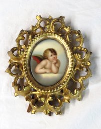 Small Painting On Porcelain Winged Cupid In A Elaborate Gold Leaf Frame