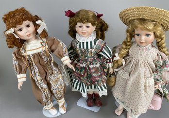 Three Pretty Porcelain Collector Dolls With Floral Dresses