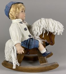 Porcelain Little Boy Doll On A Hobby Or Rocking Horse