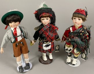 Three Porcelain Little Boy Dolls On Metal Display Stands Including Geppeddo Dolls