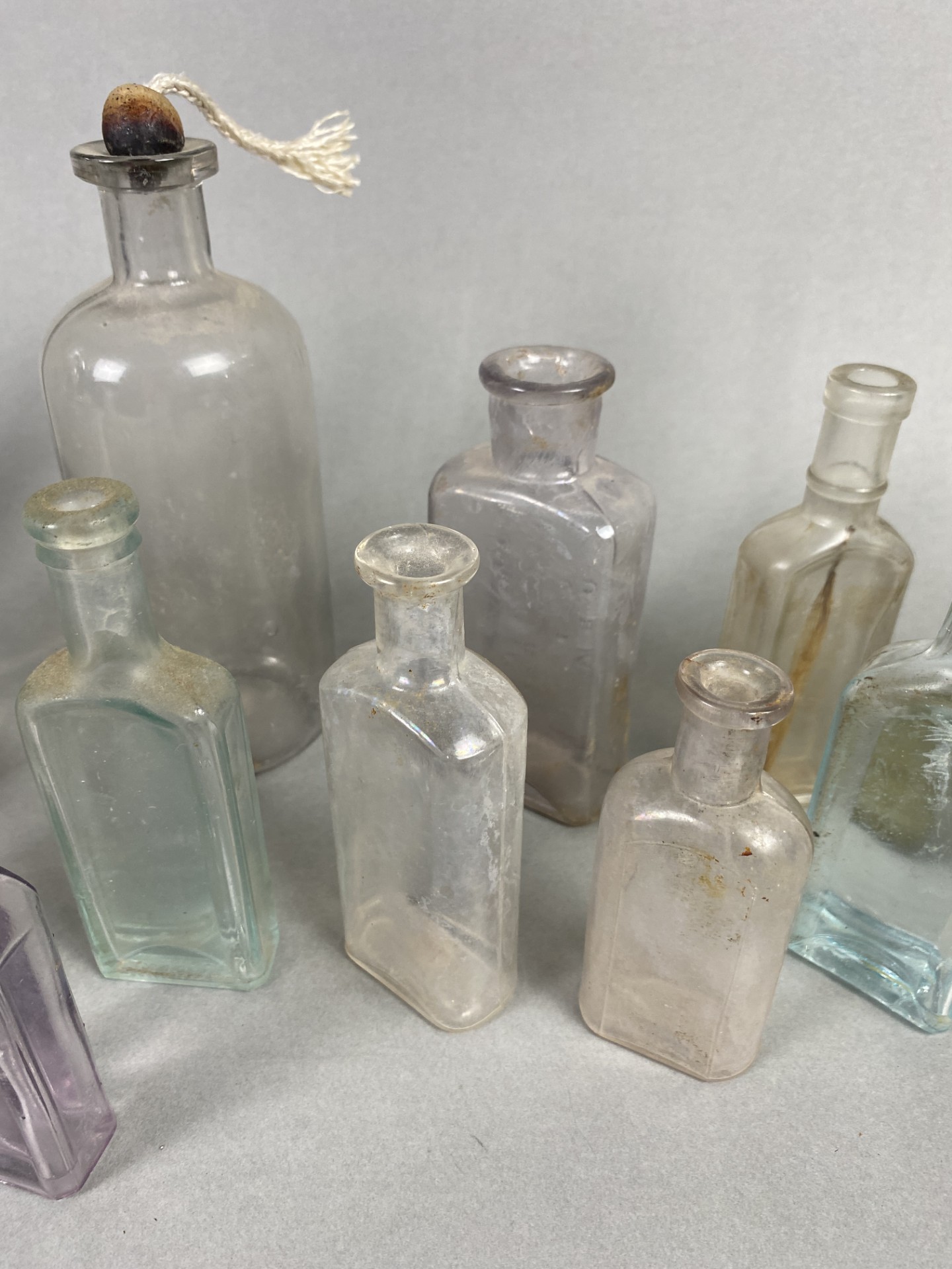 Many Vintage Glass Bottles In Different Shapes & Brands Including Gray