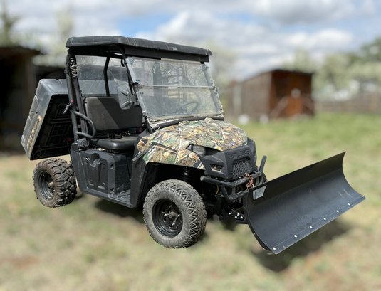 Polaris Ranger Side-by-side Utility Vehicle Equipped With A Snow Plow, Back Plow And A Camouflage Wrap