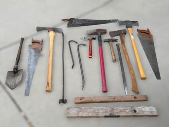 Old-School Workshop Tool Collection Featuring Hand Saws, Hammers & Iron Pry Bars