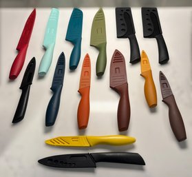 Vibrant Kitchen Knife Assortment Featuring Colorful Handles And Coordinating Blade Covers