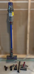 Dyson SV12 Cordless Stick Vacuum Featuring A Detachable Wand And Versatile Cleaning Attachments