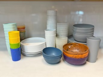 Colorful Collection Of Plastic Dinnerware Featuring Cups, Bowls And Plates