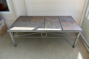 Metal-frame Tile-top Coffee Table Featuring A Scrolled Base And A Multi-tile Inlay Surface