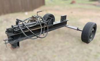 Custom-built, Tow-behind Hydraulic Log Splitter With A Black Steel Frame