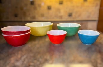 Vintage Pyrex Primary Color Mixing Bowl Collection Featuring Classic Red, Yellow, Green, And Blue Nesting Bowl