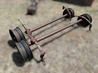 Pair Of Trailer Axles With Hubs, Springs & Steel Rims