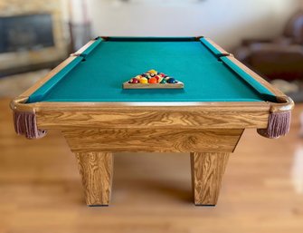 Classic Oak Billiards Table Featuring Green Felt, Leather Style Pockets, And Ball Set