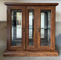 Elegant Wooden Curio Display Cabinet With Glass Paneling, Brass-toned Pendant Pulls, And Glass Shelving (1/2)