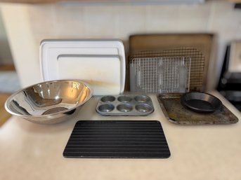 Lot Of Kitchen And Baking Tools, Including A Stainless Steel Mixing Bowl, Cutting Boards, And Baking Tins