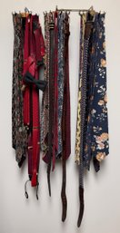 Gentleman's Accessories Collection Featuring Patterned Neckties, Suspenders, Leather Belts, And Bow Tie