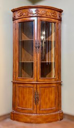 Classy Traditional Wooden Corner Curio Cabinet With Crown Molding Details And Glass Doors