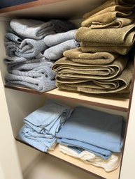 Assortment Of Powder Blue And Green Towel Sets With Blue Table Clothes And Napkins