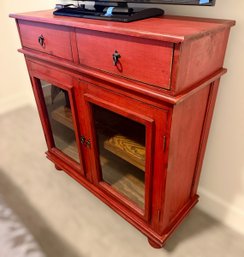 Rustic Red Wooden Sideboard Featuring A Distressed Finish With Dark Metal Hardware