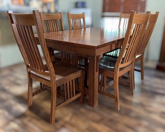 Traditional Mission-style Solid Oak Dining Table With Eight Curved Slat-Back Chairs