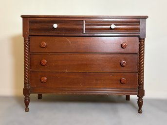 Traditional Wood Chest Of Drawers Featuring Barley Twist Columns, Turned Feet, And Classic Wood Knob Hardware