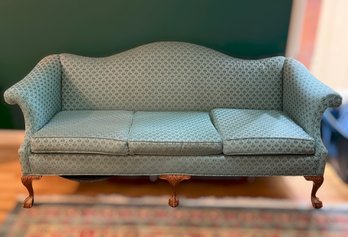 Vintage Teal Upholstered Camelback Sofa Featuring Wooden Clawfoot Legs