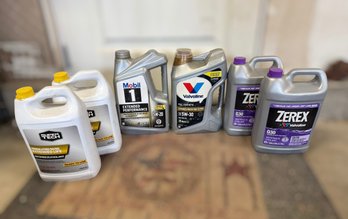 Collection Of Automotive Fluids Featuring Motor Oil And Antifreeze Coolant