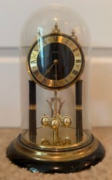 Dome Black And Gold Pendulum Clock With Rotating Torsion Pendulum