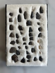 Extensive Collection Of Authentic Native American Artifacts In A Black Display Case