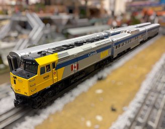 MTH HO Scale Model Of The VIA Rail Canada EMD F40PH-2D Locomotive #6402 W/ Passenger Cars
