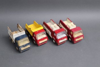 Lot Of 4 Vintage Tonka Mini Trucks  2 Fire Trucks & 2 Dump Trucks  1970s Pressed Steel USA