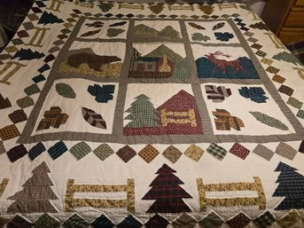 Hanging Rustic Cabin In The Woods Themed Quilt Is Reminiscent Of The 'Be My Neighbor' Quilt Pattern
