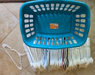 Laundry Basket And Group Of Adult Plastic Hangers