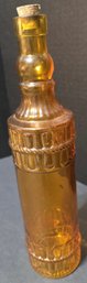 Amber Or Orange Pressed Glass Decorative Bottle With A Cork Stopper And An Embossed Rope Design