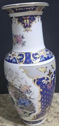 Porcelain Vase Featuring A Detailed Hand-painted Depiction Of Peacocks And Flowers