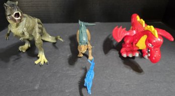 Collection Of Toy Dinosaurs And A Dragon