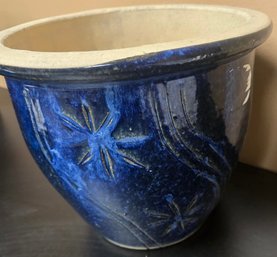 Blue Ceramic Planter With A Textured Pattern And A Light-colored Rim