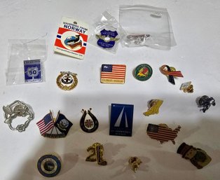 Collection Of Various Vintage-style Lapel Pins And Buttons