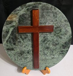 Decorative Tabletop Cross Featuring A Wooden Crucifix Mounted On A Circular Green Marble Disc