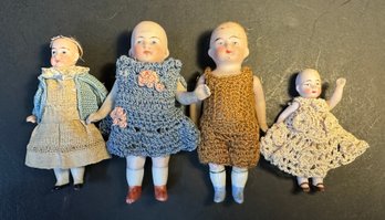 Four Small Antique Bisque Dolls