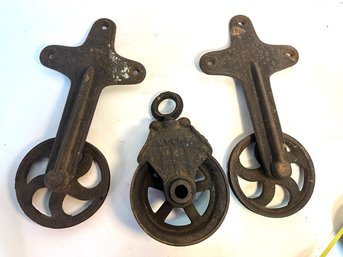 Three Antique Barn Pulleys