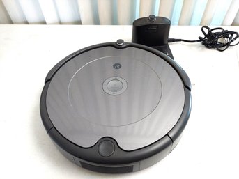 Charcoal Grey IRobot Roomba 600 Series Robot Vacuum With Its Charging Base